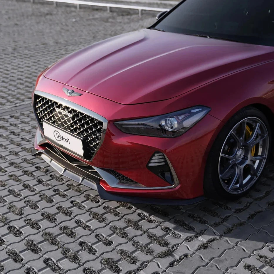 ADRO carbon fiber front lip V2 on Genesis G70, front left angle, installed view on interlocking stone.