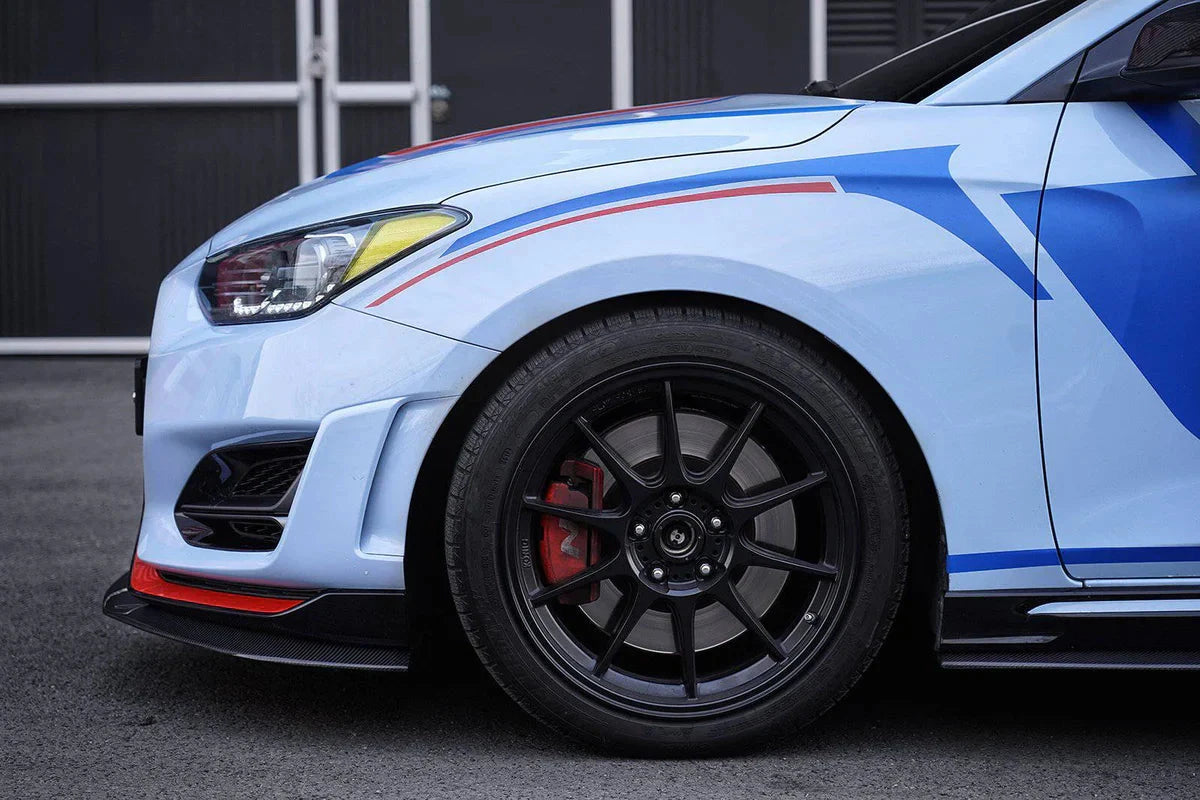 ADRO carbon fiber side skirts V1 installed on Hyundai Veloster N, close-up detail view.