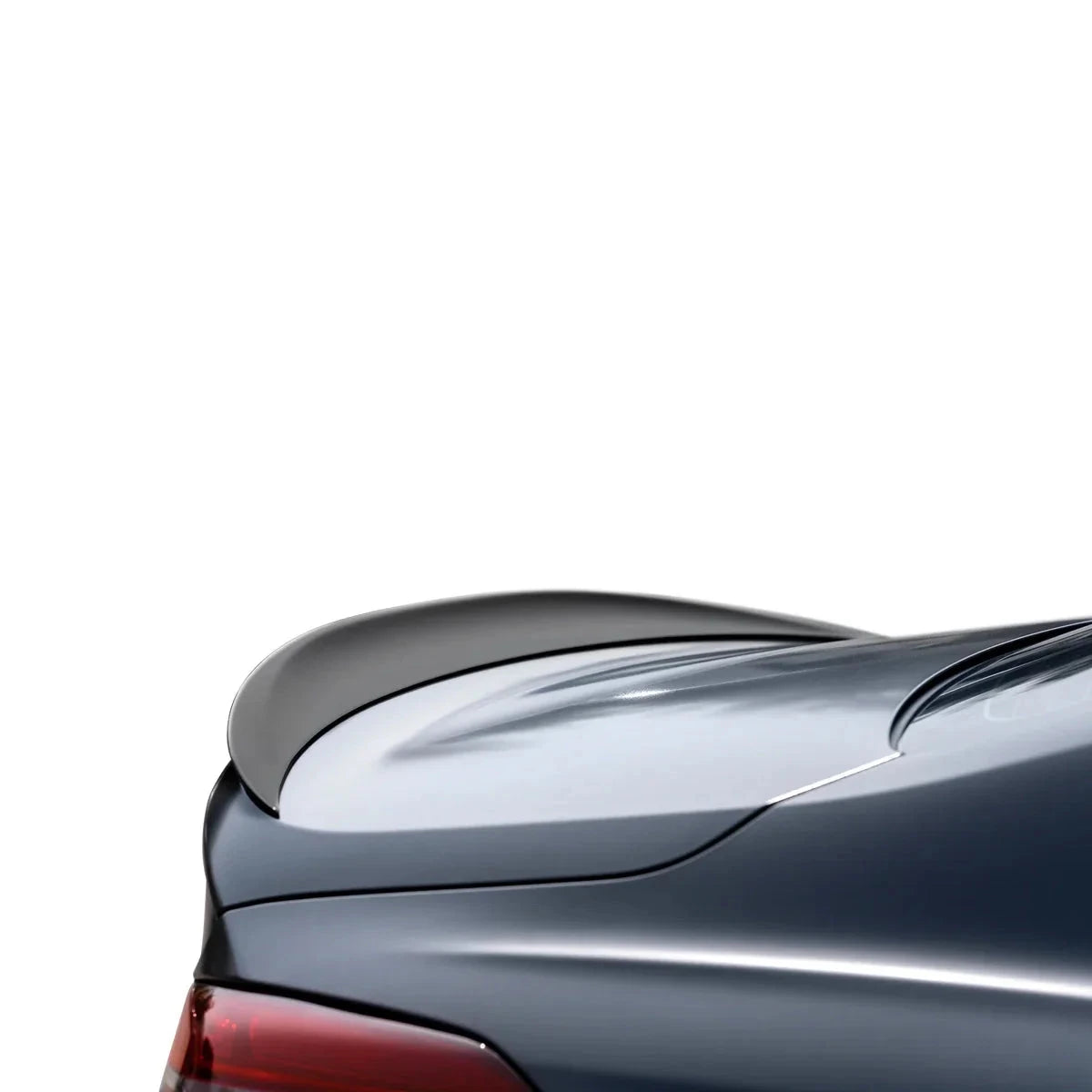 ADRO carbon fiber spoiler for Genesis G70 FL, detail view on silver trunk against a white background.