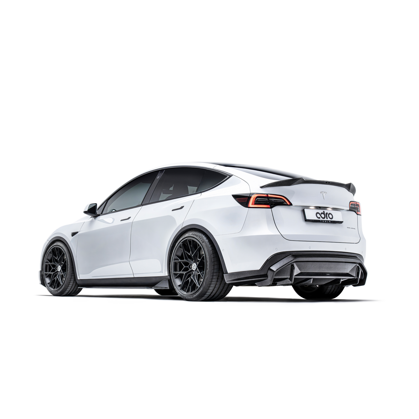 ADRO Carbon Fiber Spoiler V2 on Tesla Model Y, rear view with black custom wheels.