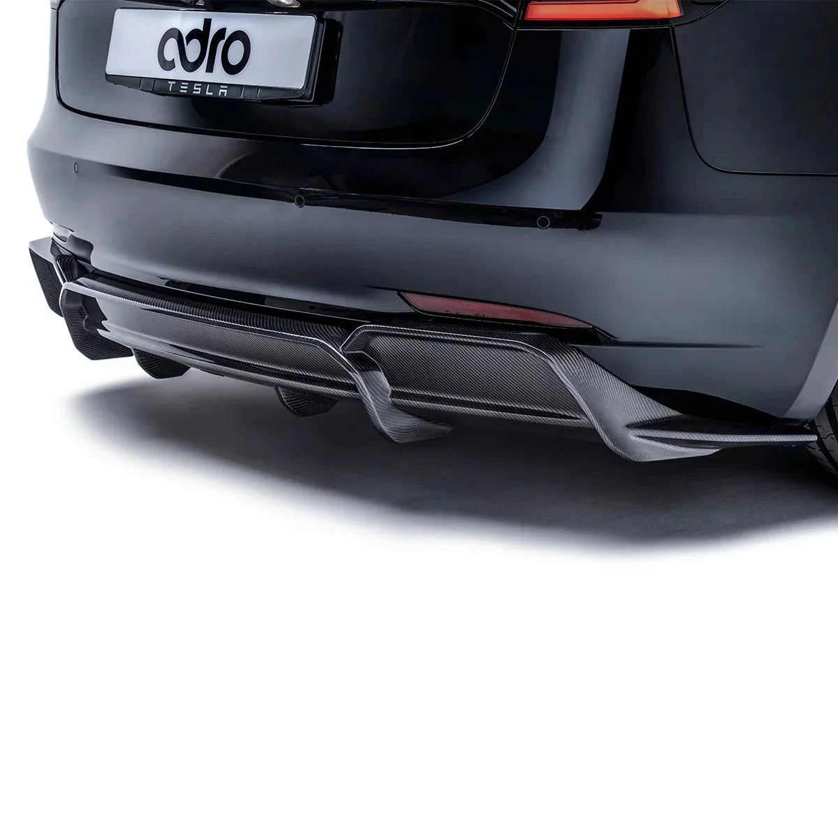 ADRO rear diffuser on Tesla Model 3, carbon fiber V2, rear view with ADRO Tesla license plate.