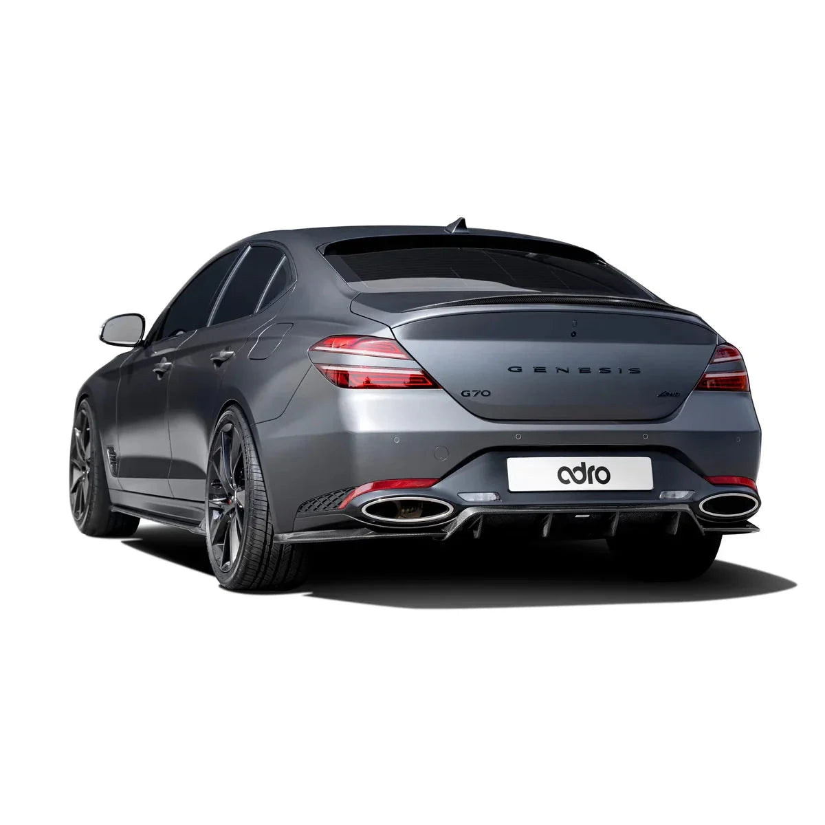 ADRO carbon fiber aero parts on Genesis G70 Facelift, rear three-quarter view, showing dual exhaust and dark tints.