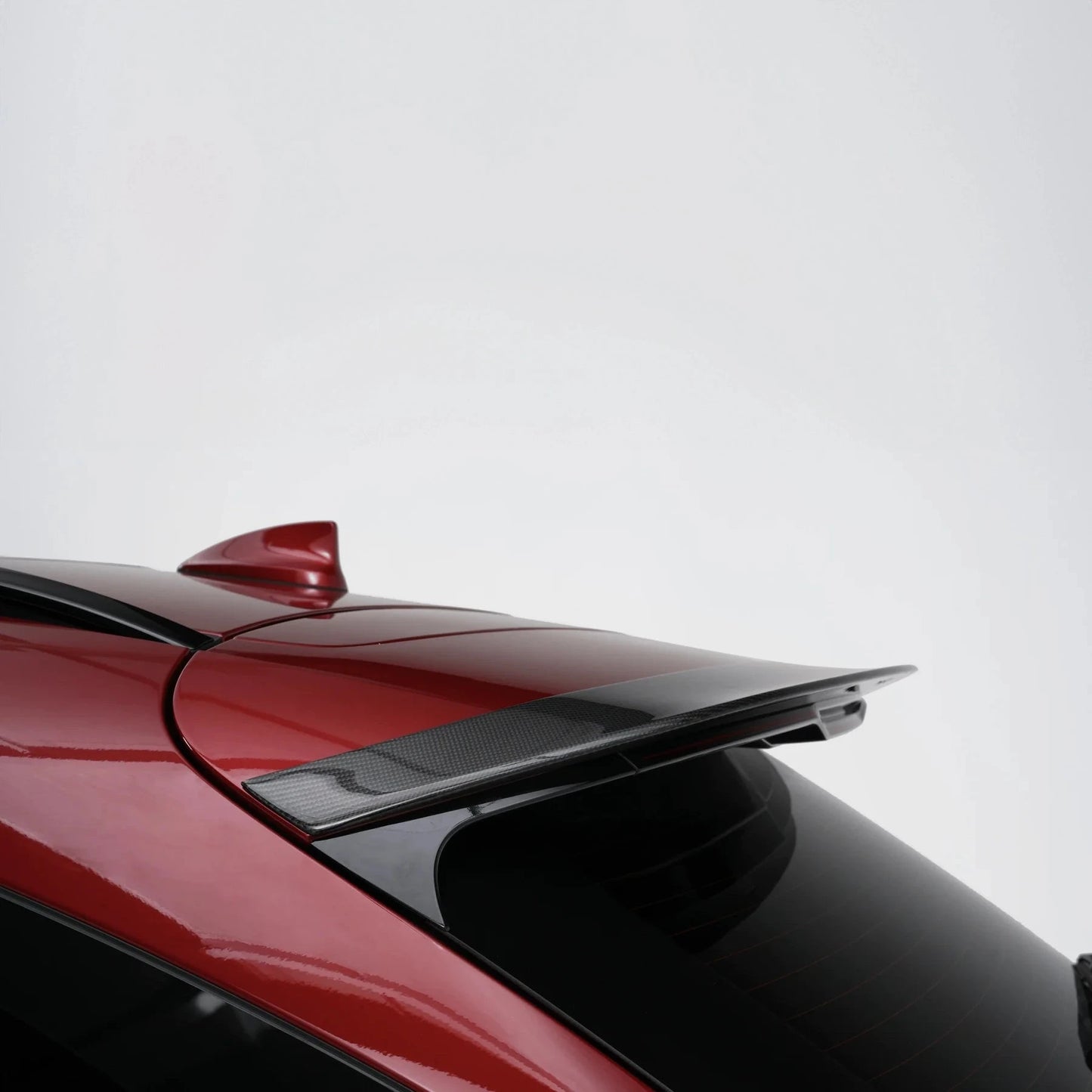 Carbon fiber rear spoiler, black textured weave with integrated air-channel cutout