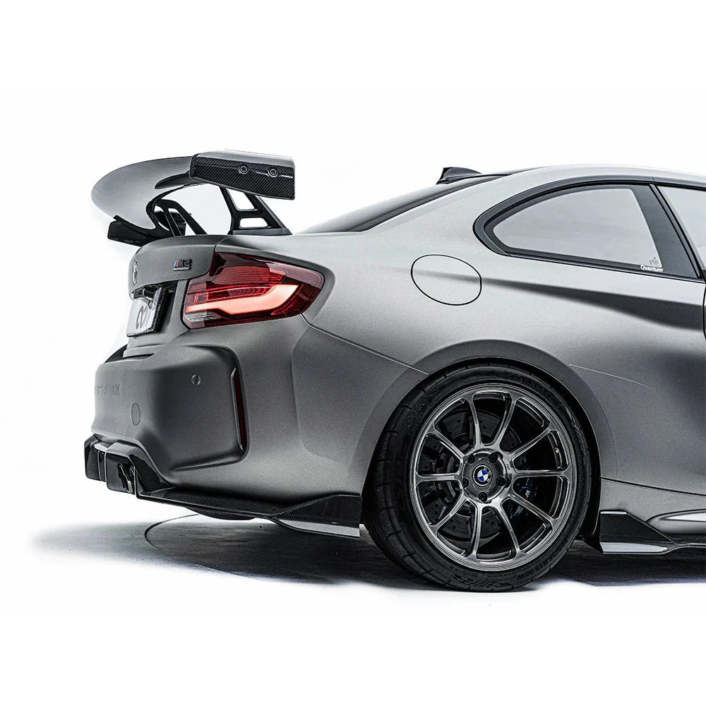 BMW F87 M2 rear diffuser made of carbon fiber by ADRO US, showcasing a sleek, aerodynamic design for enhanced vehicle performance.