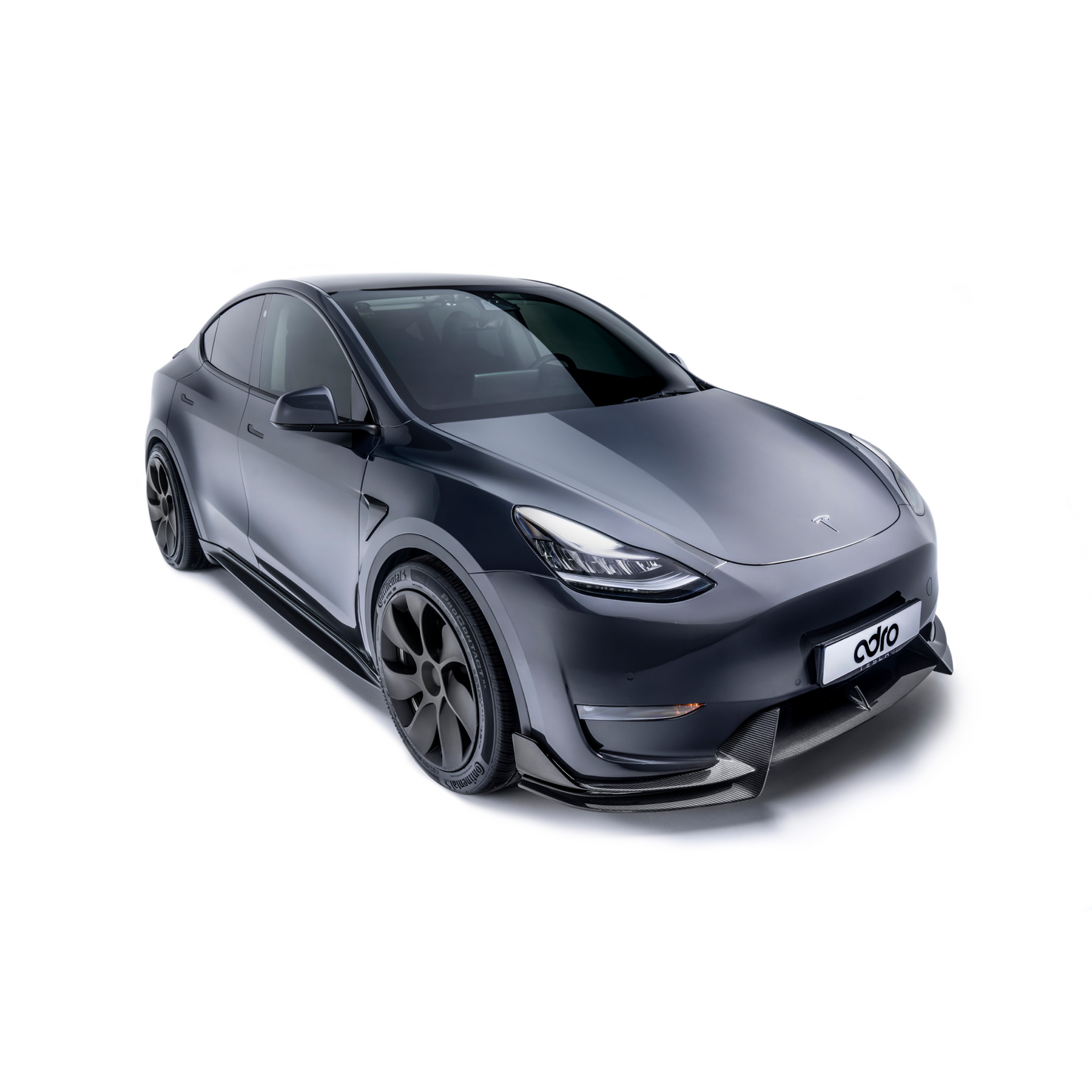 ADRO Side Skirts V1 for Tesla Model Y, installed view on matte gray vehicle with black wheels against white background.