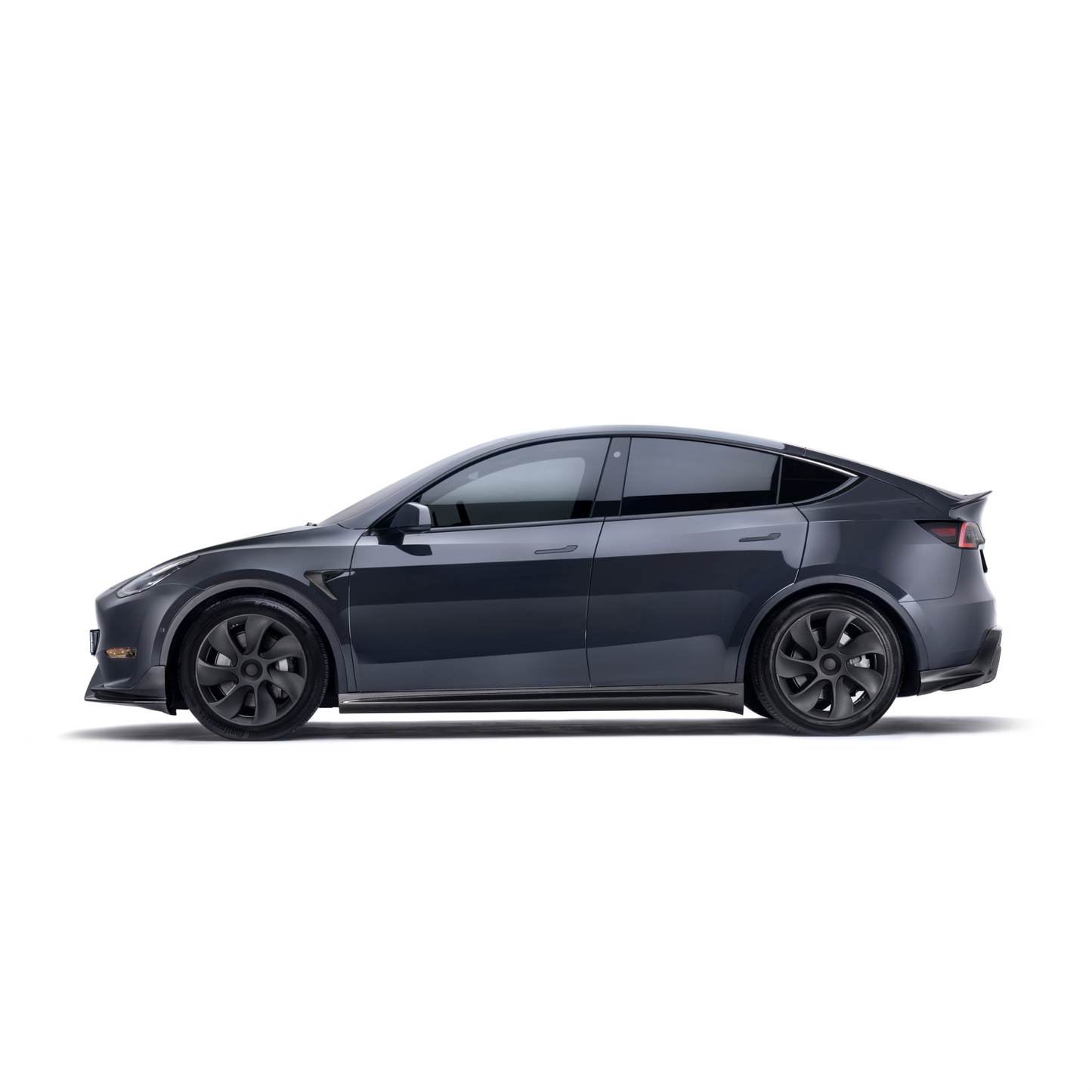 ADRO front lip for Tesla Model Y, side profile view, installed on dark gray car with aero black wheels, white background.