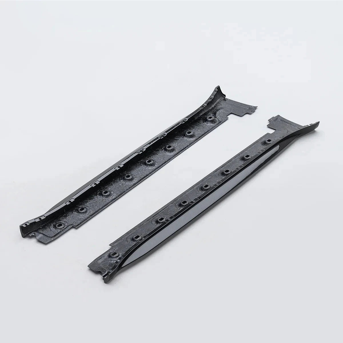 ADRO Porsche 992.1 GT3 Prepreg side skirts shown side by side on a light gray background, top-down view.