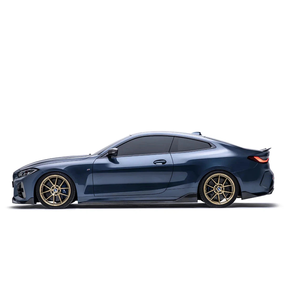 ADRO carbon fiber front lip on BMW G22 M440i, side view, dark blue paint, tinted windows, and gold wheels shown.