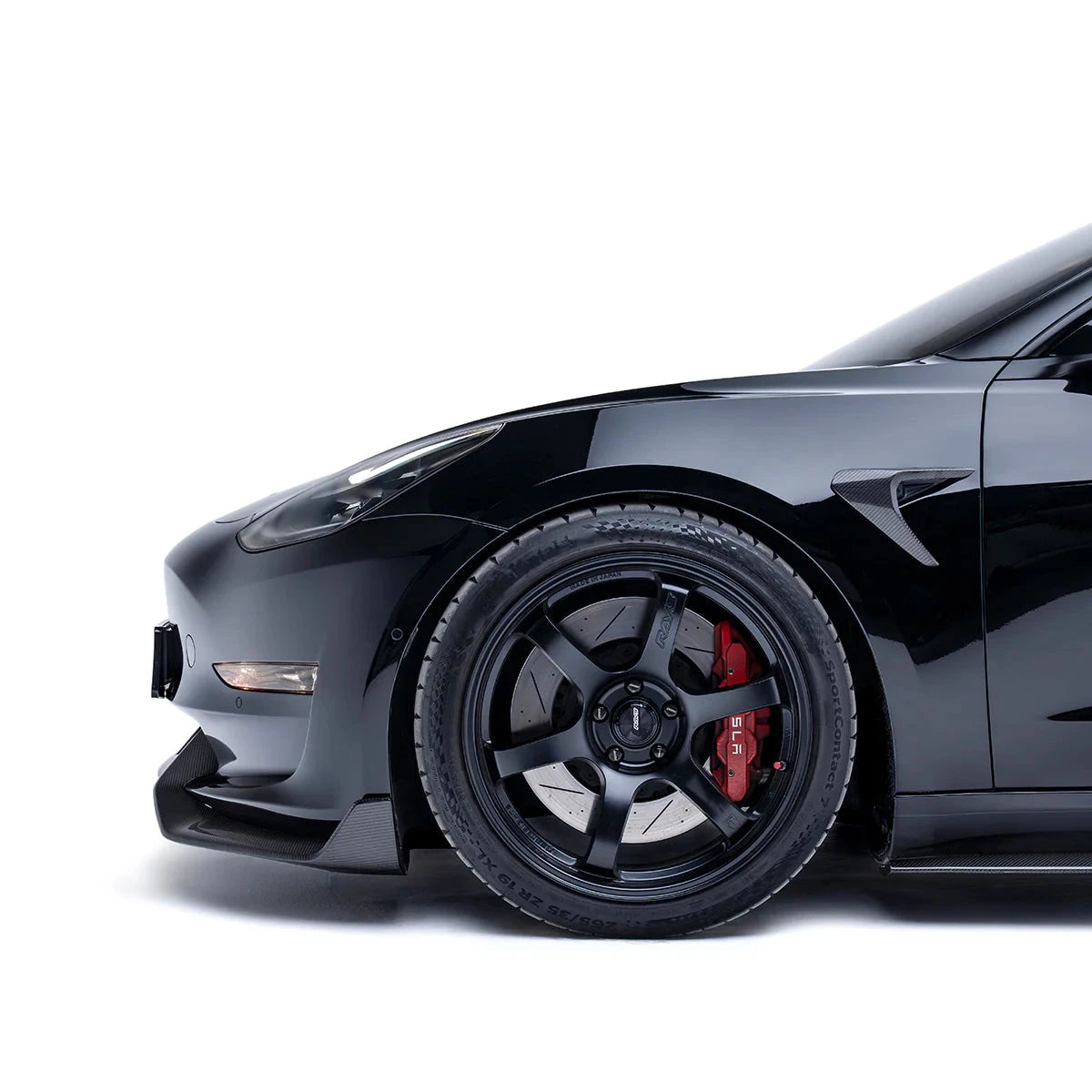 Carbon fiber front lip side fin near front wheel opening