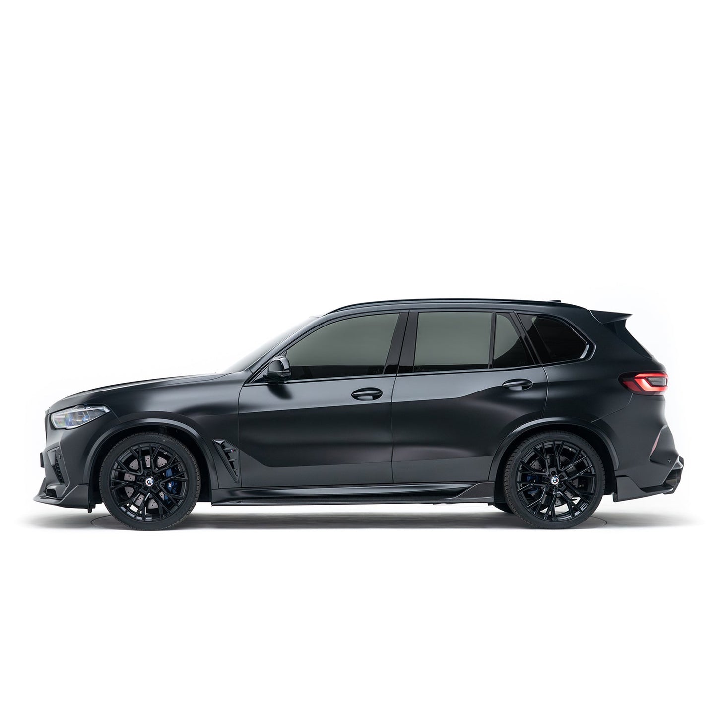 Front bumper lip on dark SUV, side profile view