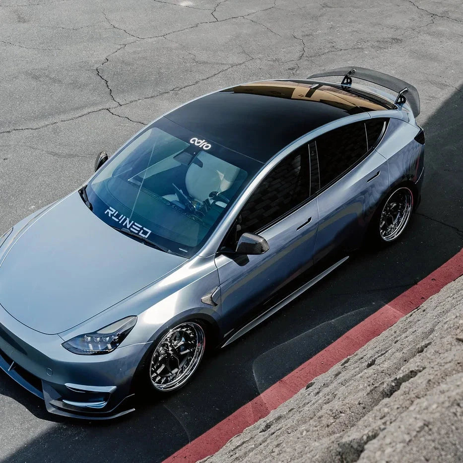Tesla Model Y rear wing and swan neck mounts, overhead view of the car