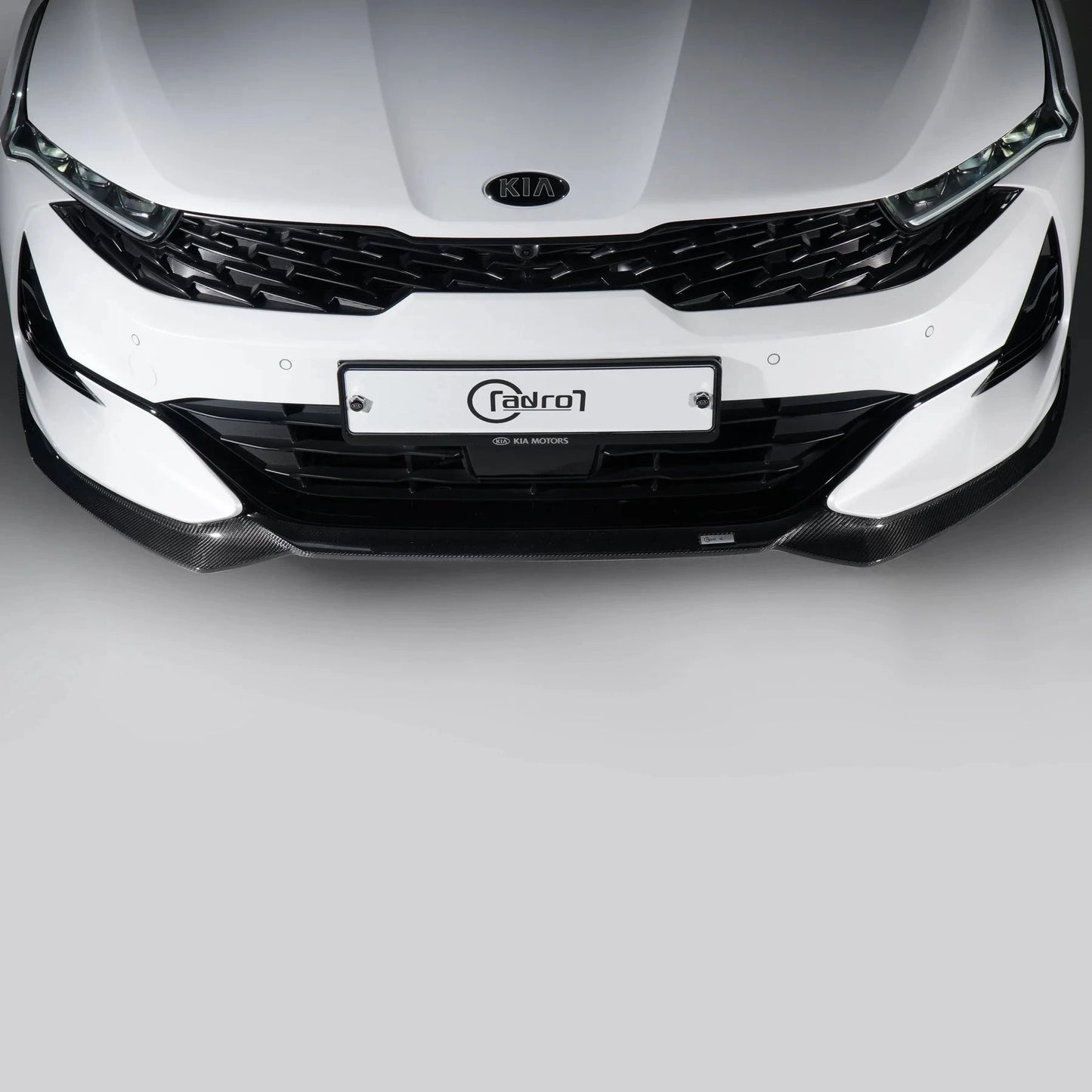 KIA K5 DL3 carbon fiber front lip across front bumper, black carbon weave finish