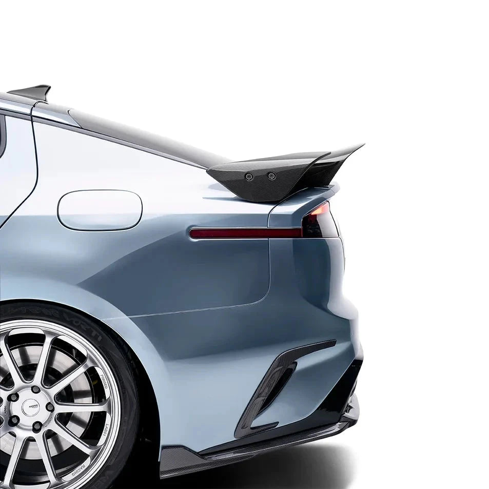 ADRO carbon fiber spoiler V3 on Kia Stinger rear, close-up installed view showing carbon fiber accents.