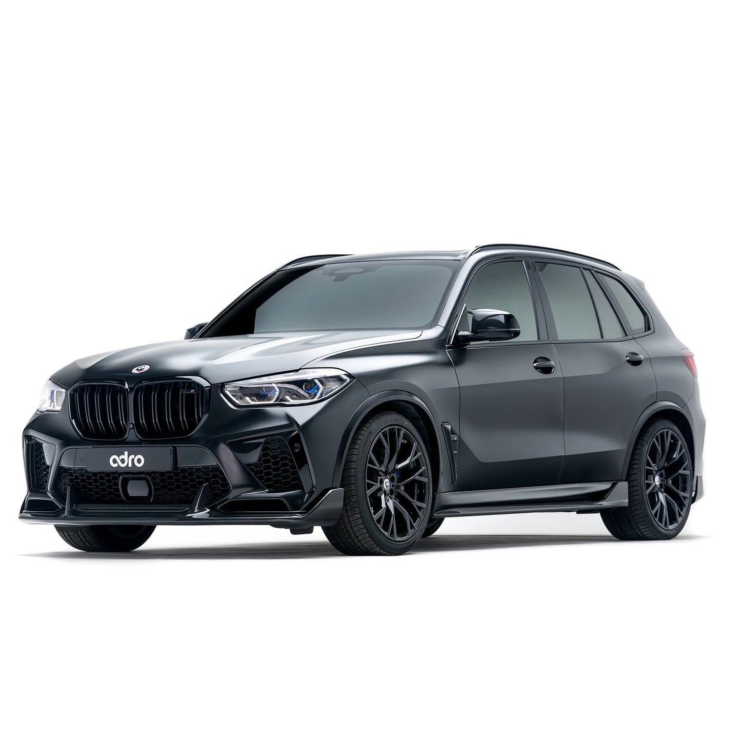 BMW X5M front view showing dark carbon-style side skirt extensions