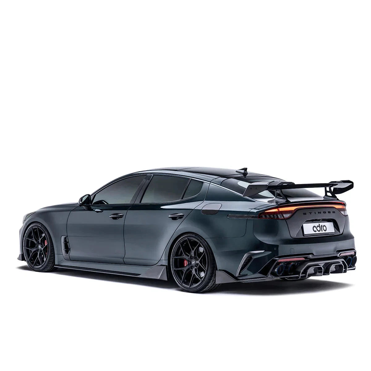 Swan neck rear wing spoiler with black carbon-fiber style blade and endplate brackets