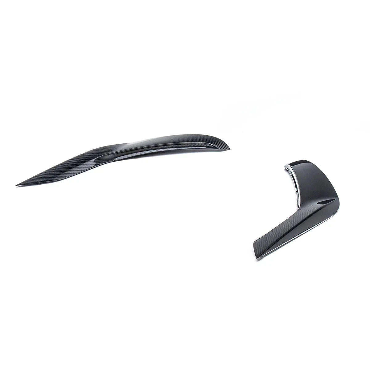 Set of dark carbon fiber door garnish pieces with chrome-style edge trim