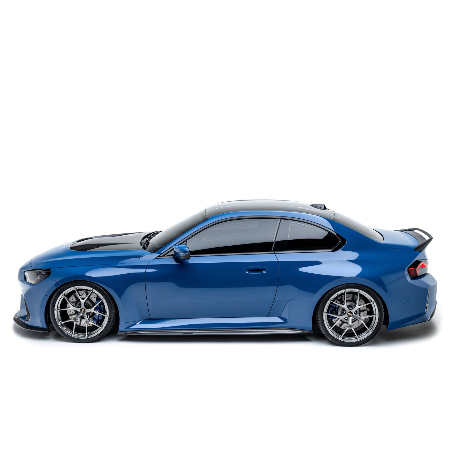 BMW M2 front bumper in blue with air intakes and front splitter