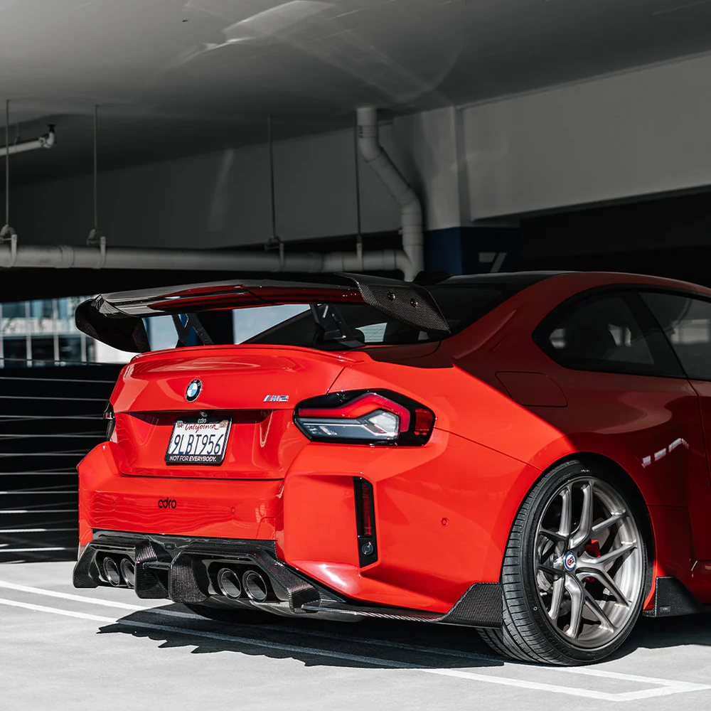 Rear swan neck wing spoiler with carbon-fiber style black trim and mounting points