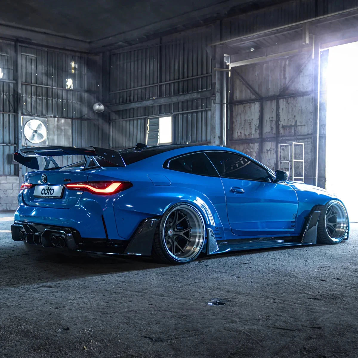 BMW G82 M4 widebody kit, side fender flares, side skirts, and rear spoiler