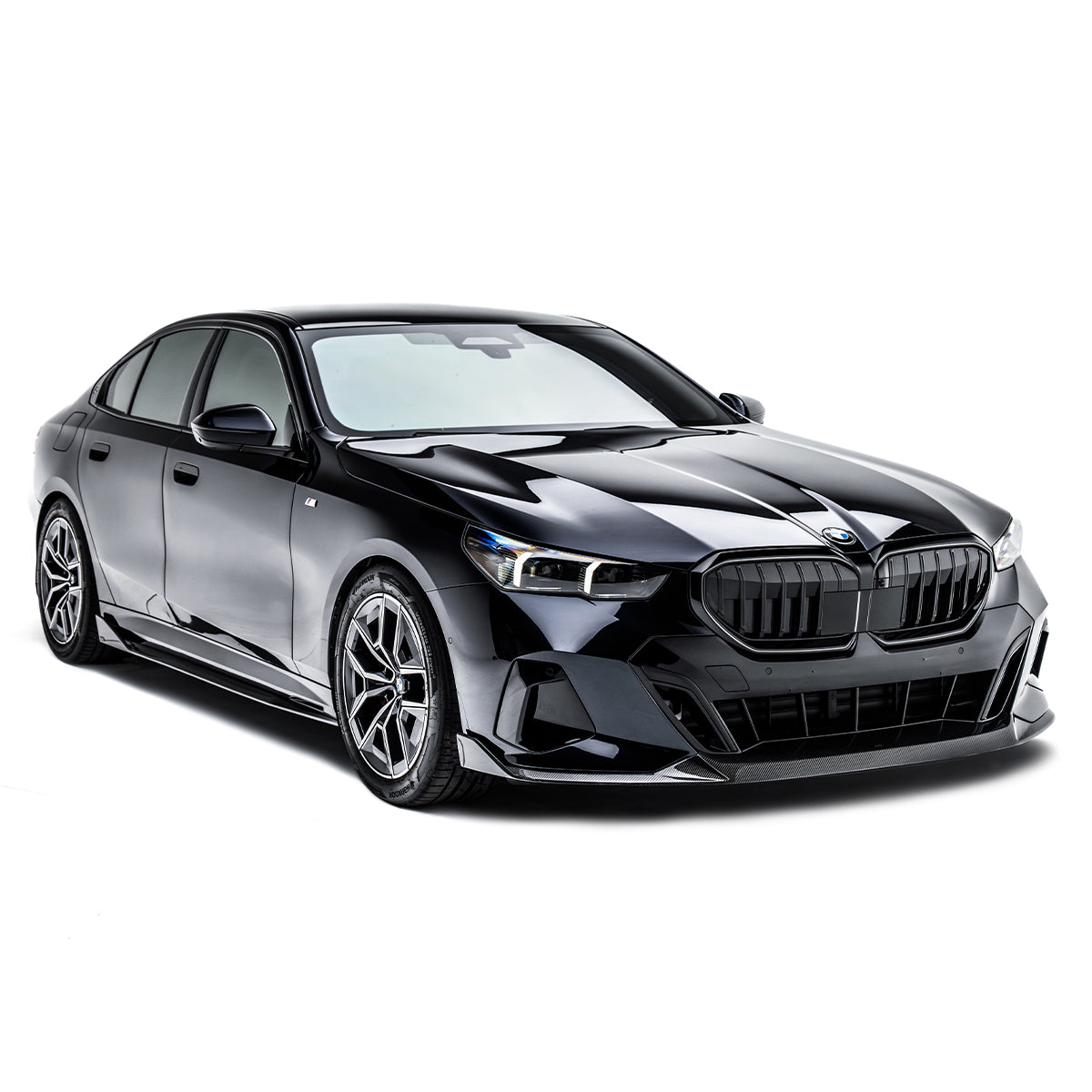 Carbon fiber side skirts, dark trim along rocker panel on black sedan