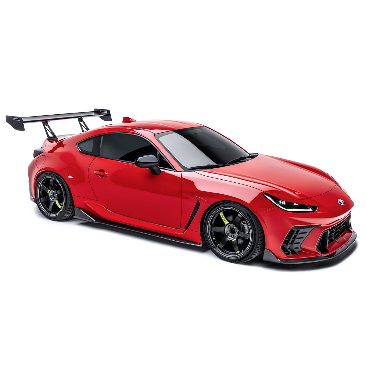 Red front bumper with black grille vents and aggressive lower aero panel