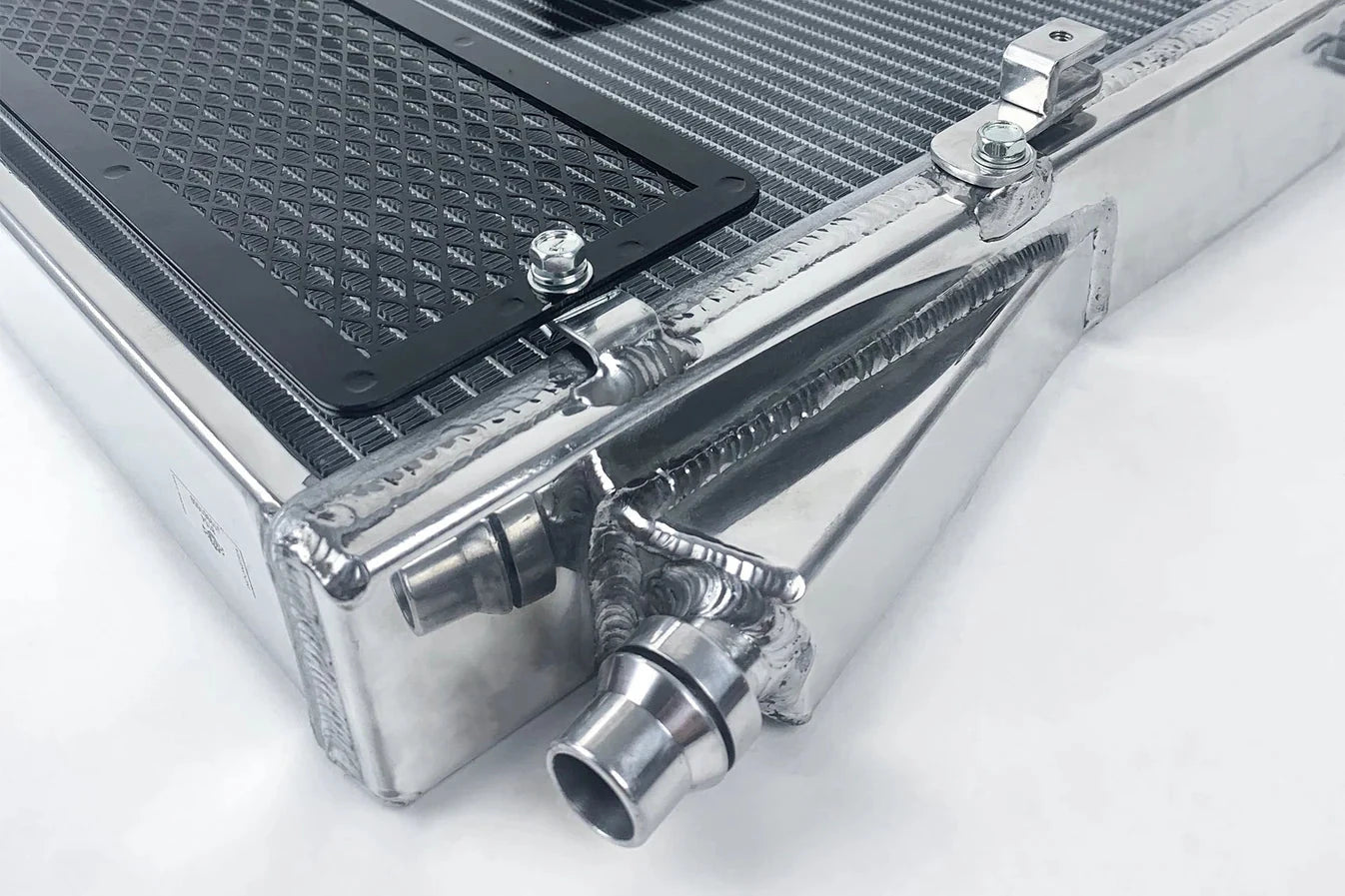 Heat exchanger radiator corner detail with rock guard mesh and metal fittings