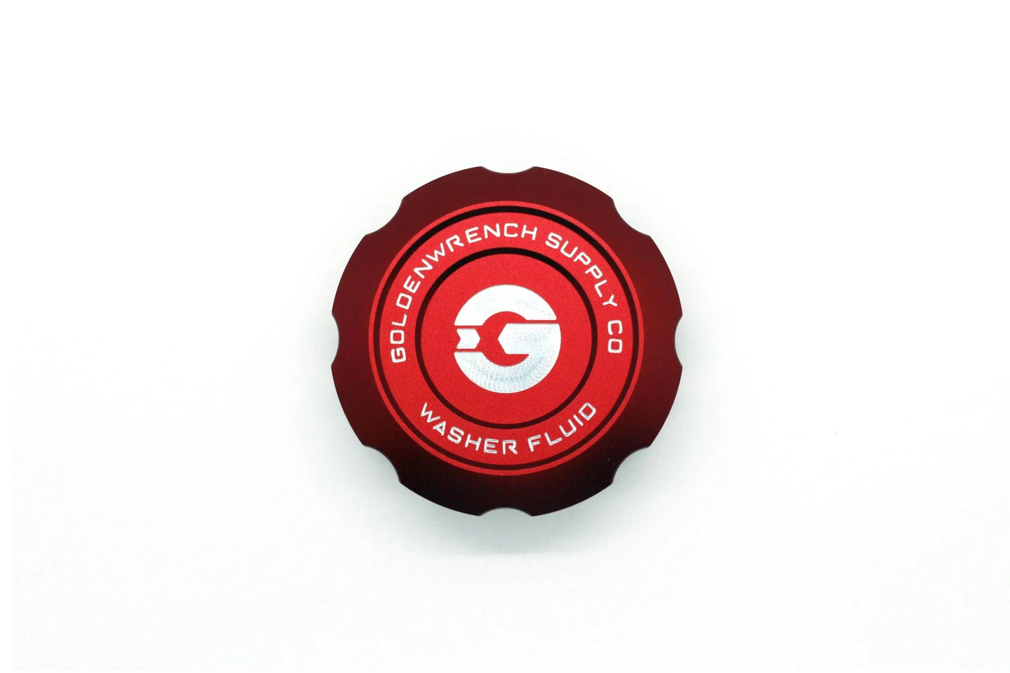 Washer fluid cap in red with circular emblem and "WASHER FLUID" text