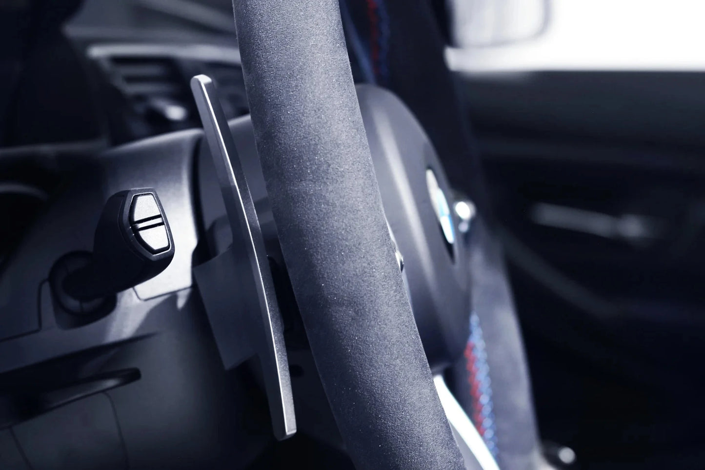 Silver paddle shifter on steering trim with black housing