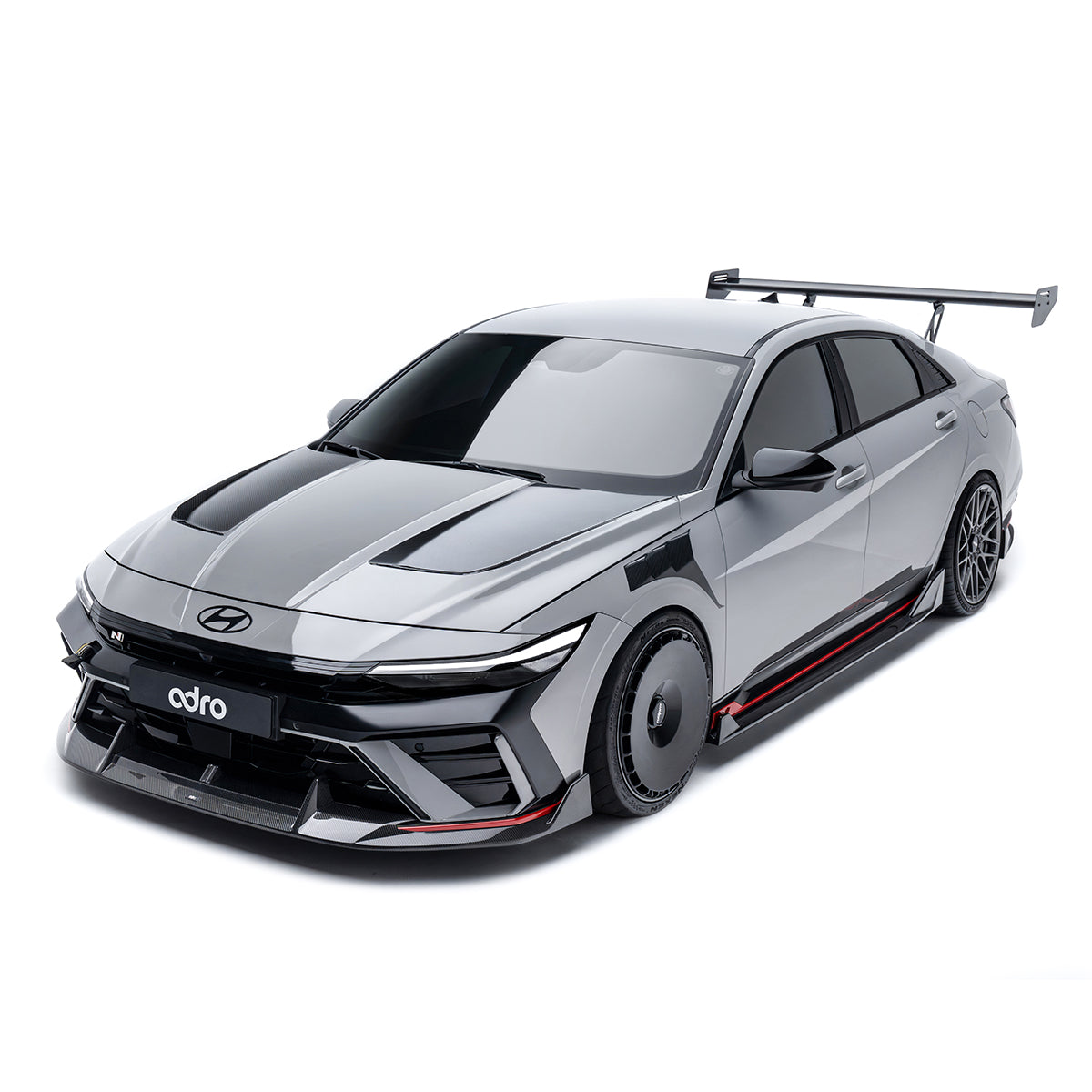 Sports car front lip and lower diffuser with black vents and carbon-fiber accents