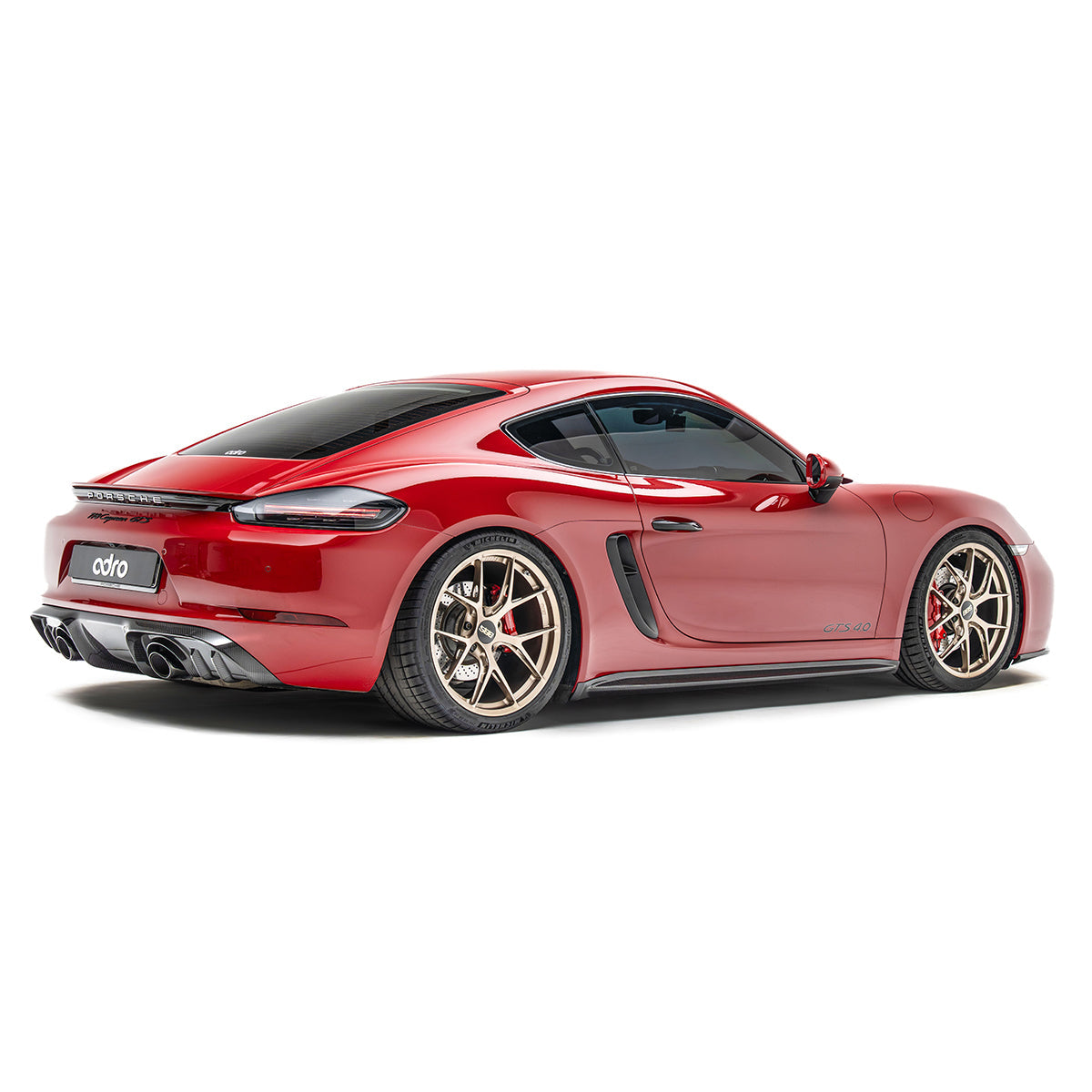 Black rear diffuser with vent fins and twin exhaust outlets on rear bumper