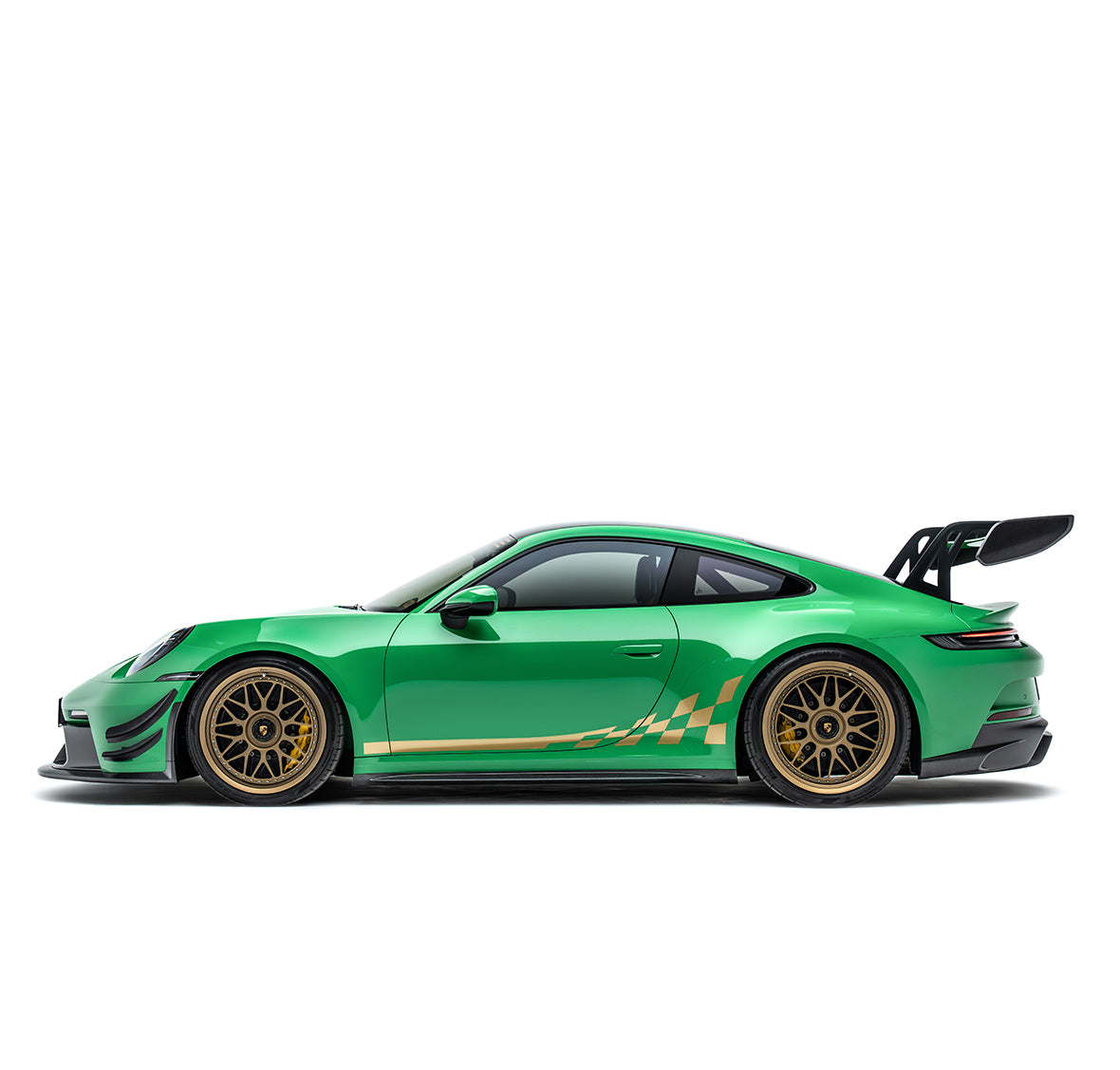 Front air canards and splitter extensions in black on green sports car side view