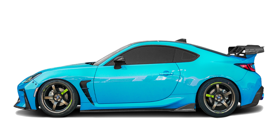 Subaru BRZ sports coupe in blue, side view with black wheels and rear spoiler