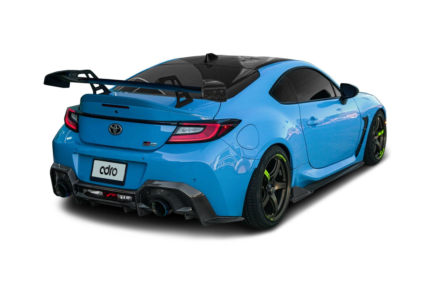 ADRO Swan Neck Wing for Toyota GR86, rear left view, installed on blue car with black wheels, white background.