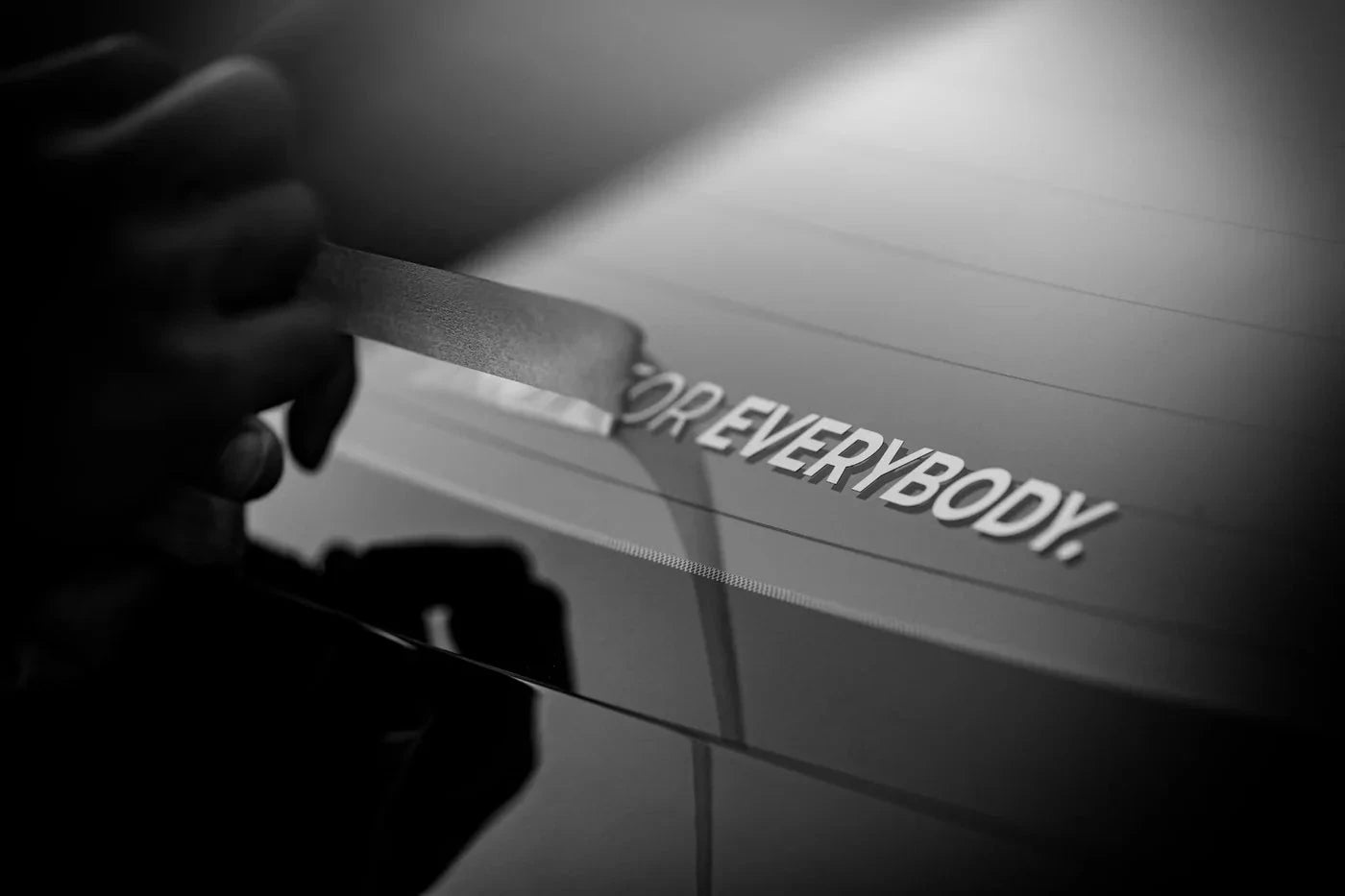 Decal on car hood with hand visible, text “NOT FOR EVERYBODY.”