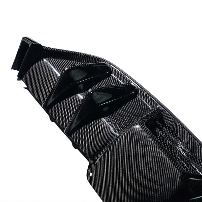 Carbon fiber rear diffuser with glossy weave texture and molded fin channels