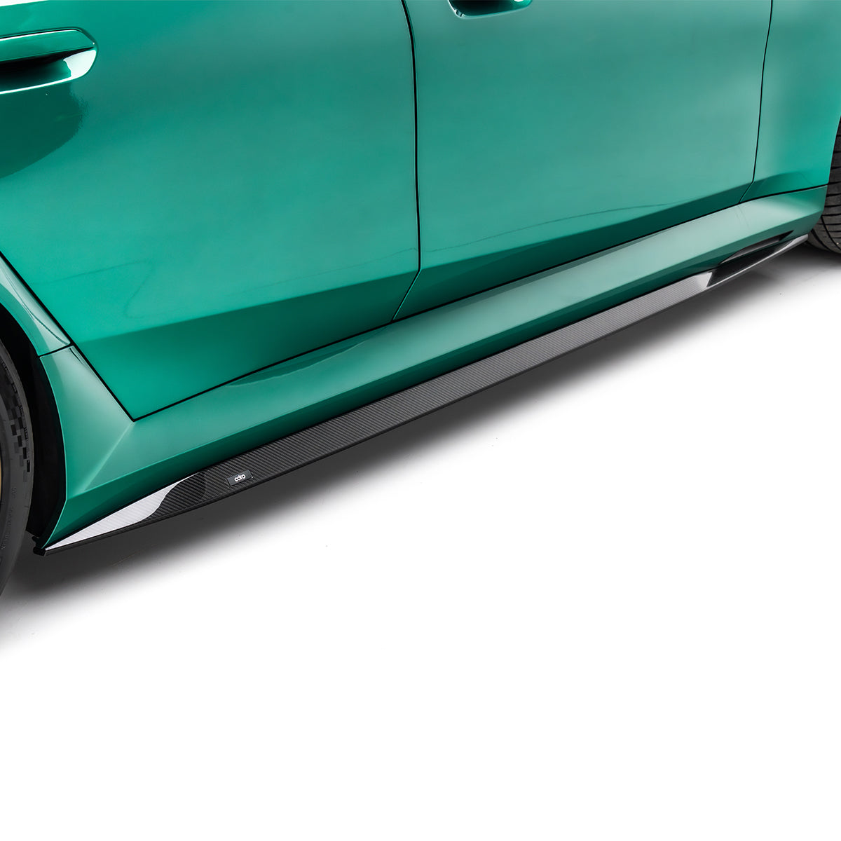 Carbon fiber side skirt with black weave texture and a slim edge strip