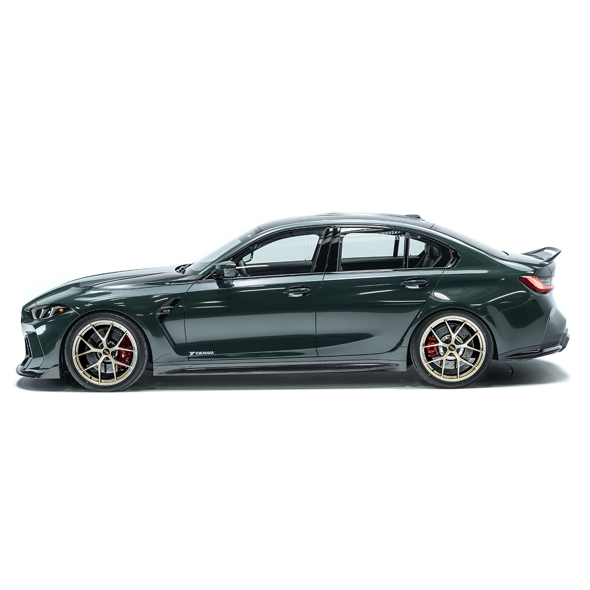 Side view of front bumper with grille mesh and angular vent accents, dark green