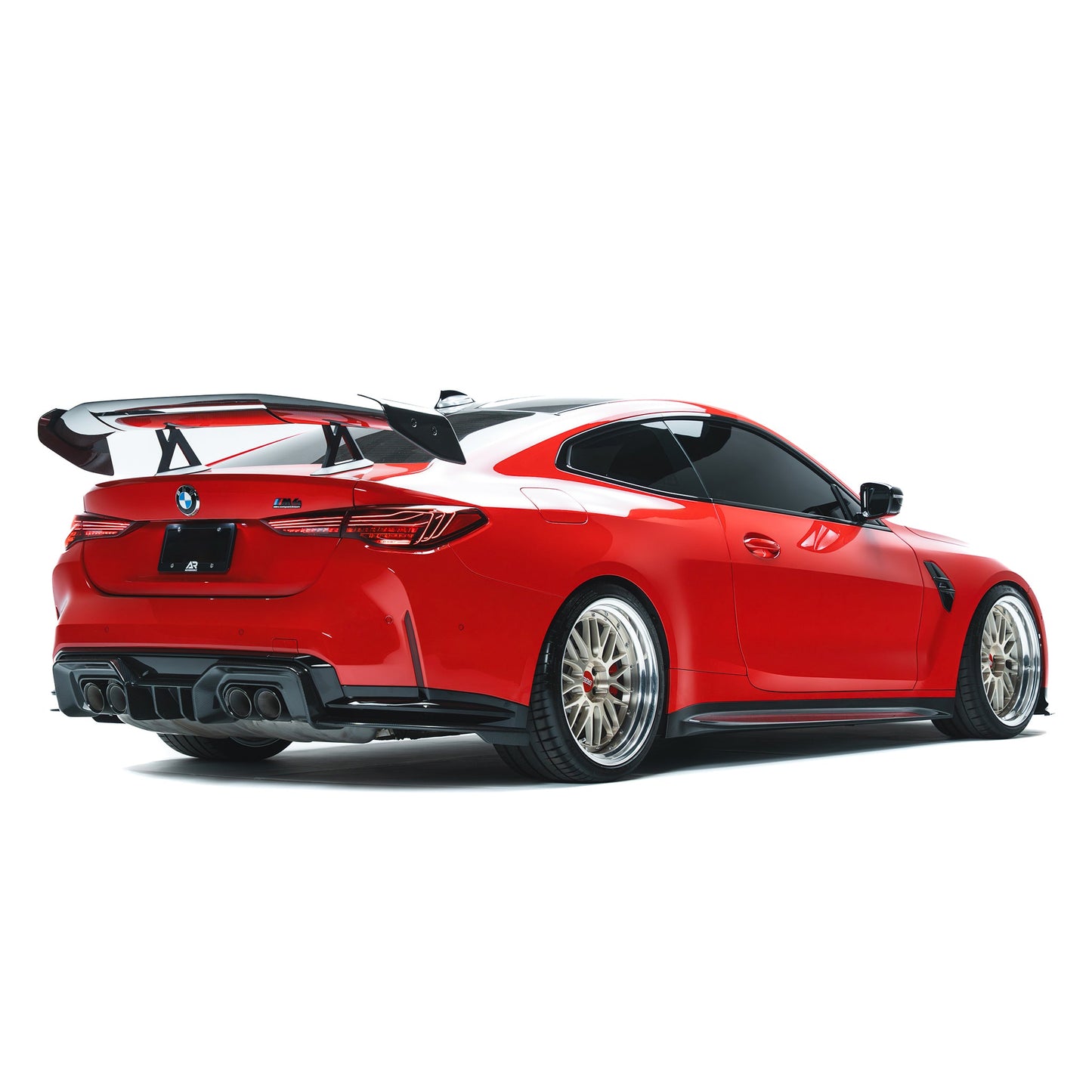BMW M4 side skirts in black, shown on rear quarter view