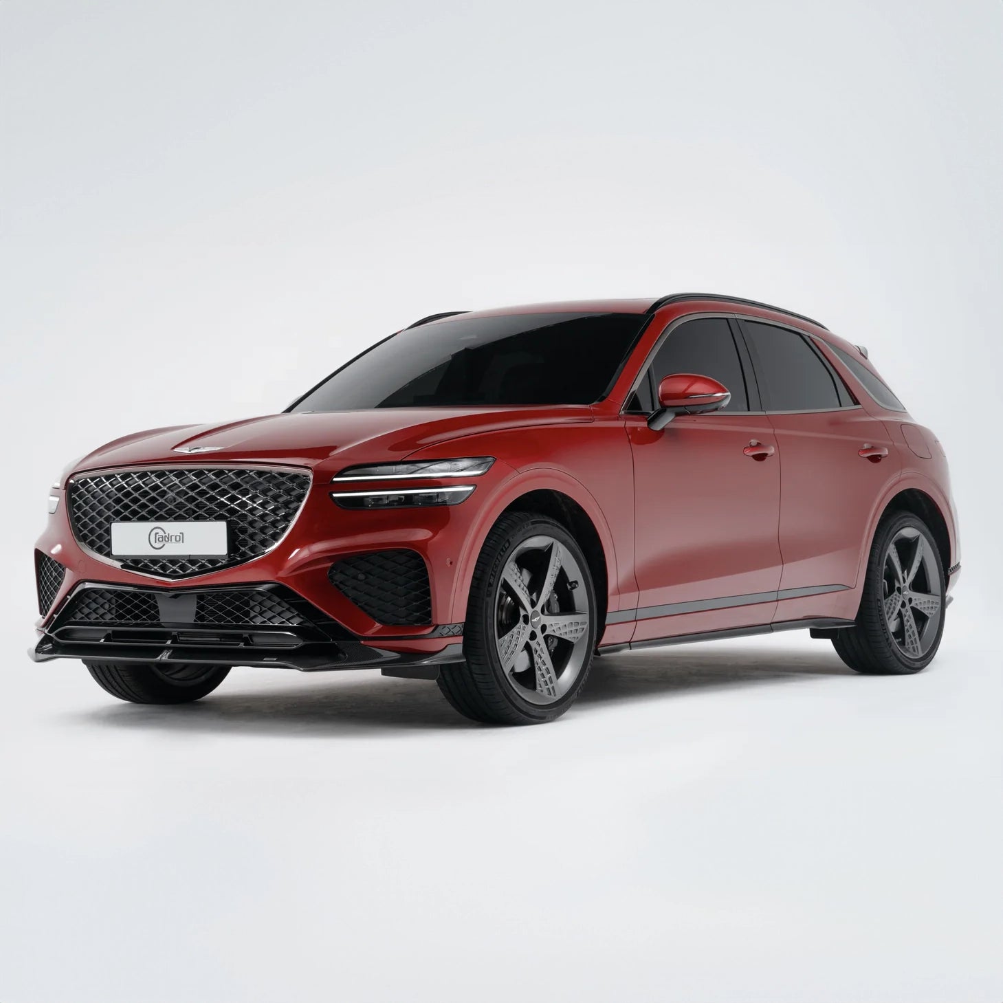 Red SUV, chrome grille, black wheels, tinted windows, front three-quarter view