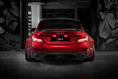 Red performance sedan rear view with tail lights, diffuser, and dual exhaust tips