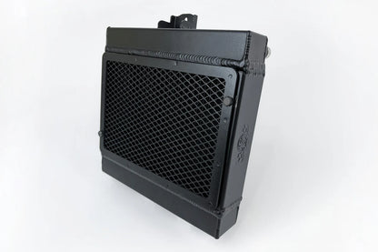 High-performance auxiliary radiator, front view of black mesh core with side brackets