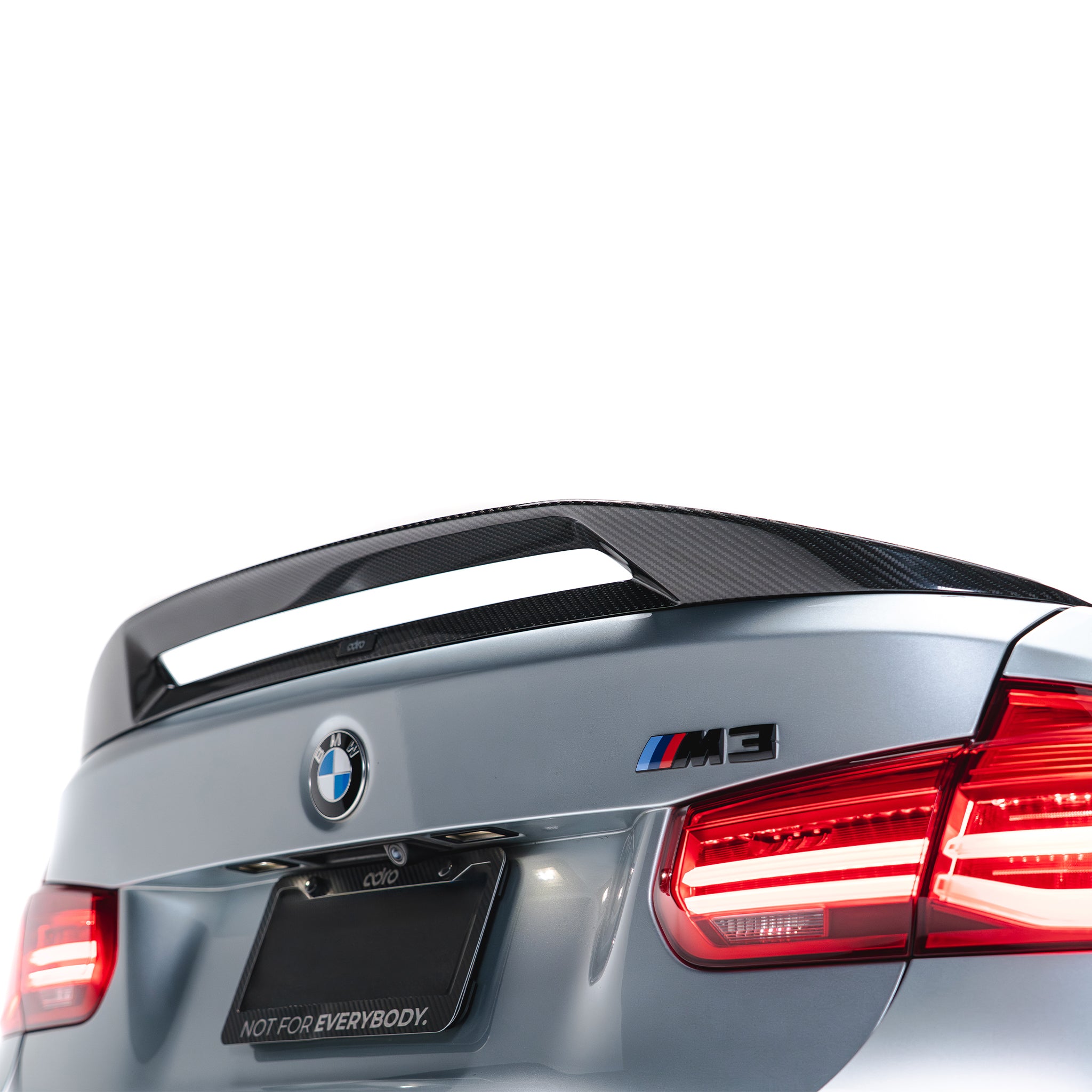 Carbon fiber trunk spoiler with textured weave finish