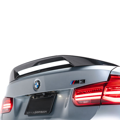Carbon fiber trunk spoiler with textured weave finish