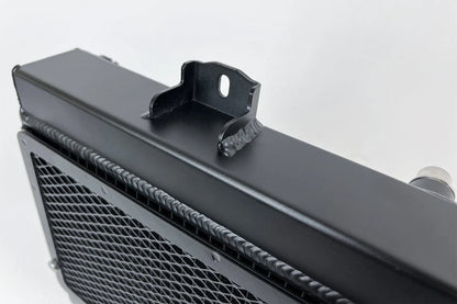 Auxiliary radiator with top mounting bracket and black mesh core visible