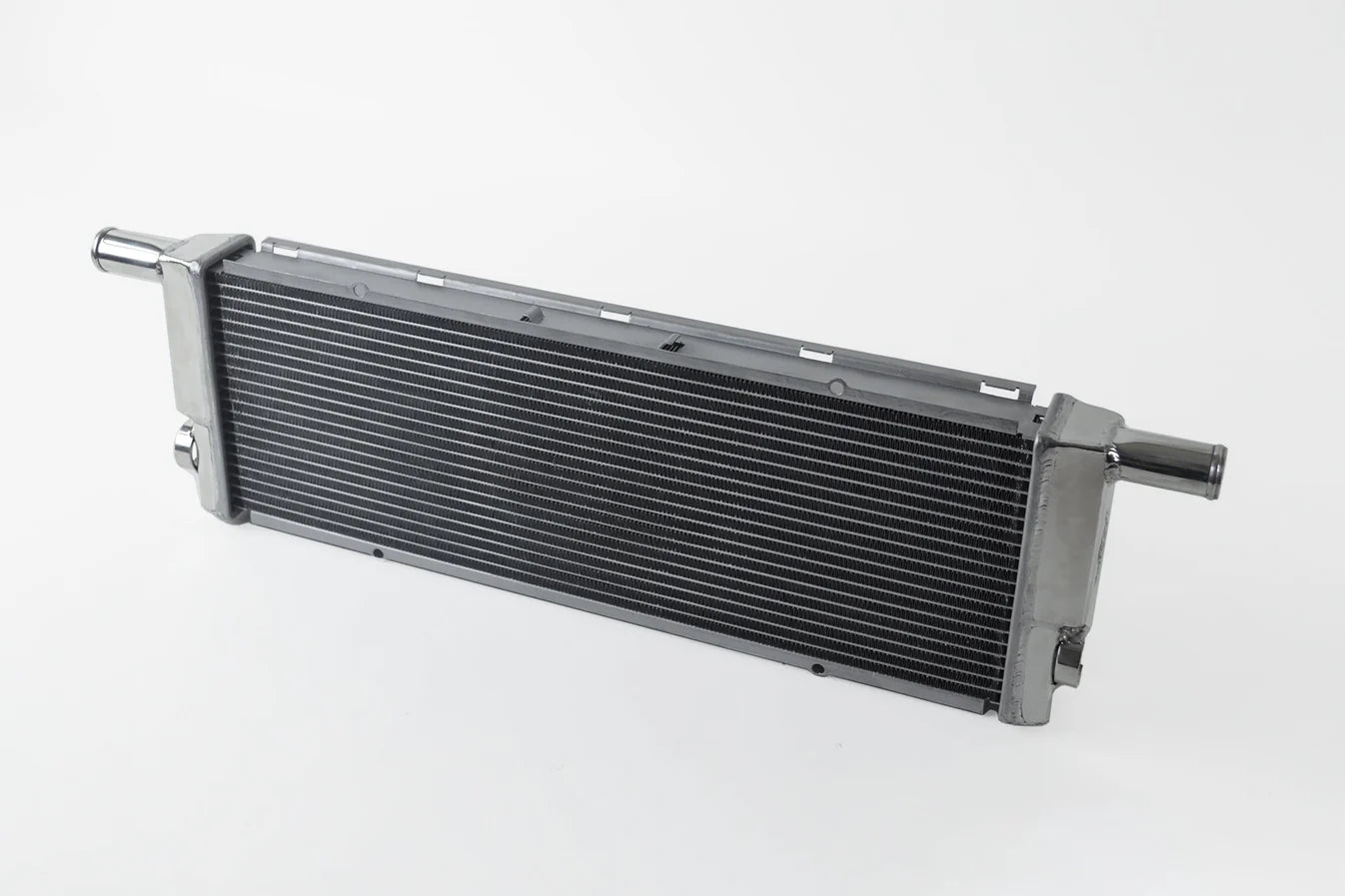 All-aluminum center radiator with dark fin core, silver end tanks and tube fittings