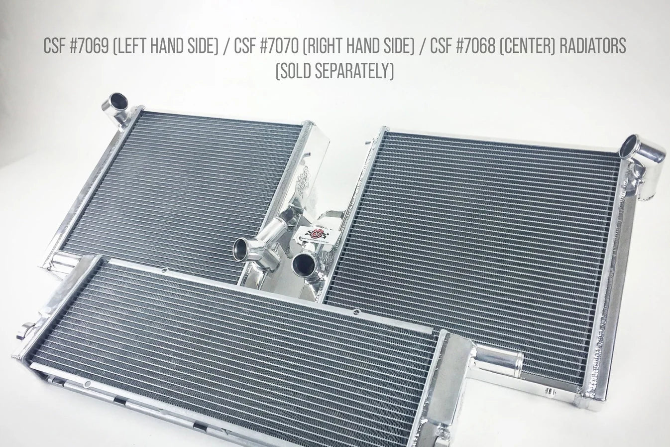 All-aluminum radiator with dark fin cores, silver end tanks and multiple inlet fittings