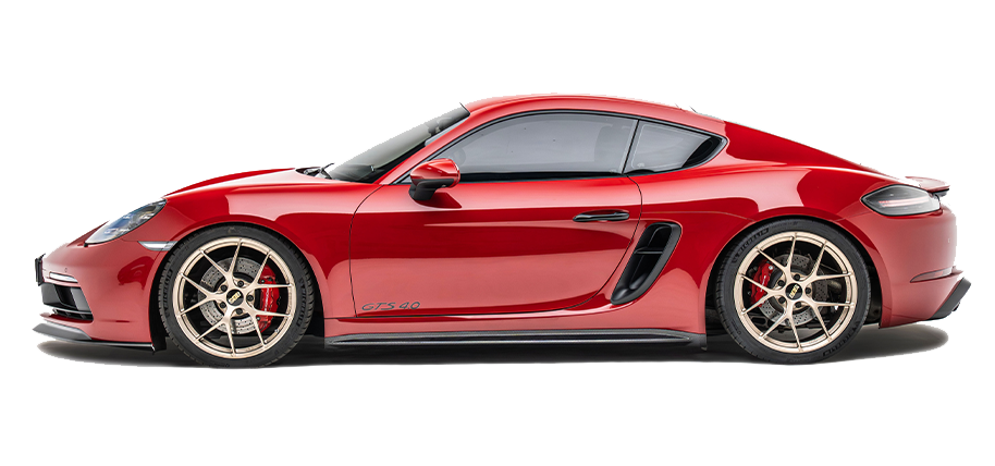 Red sports car with black side air vents and racing wheels, side profile.