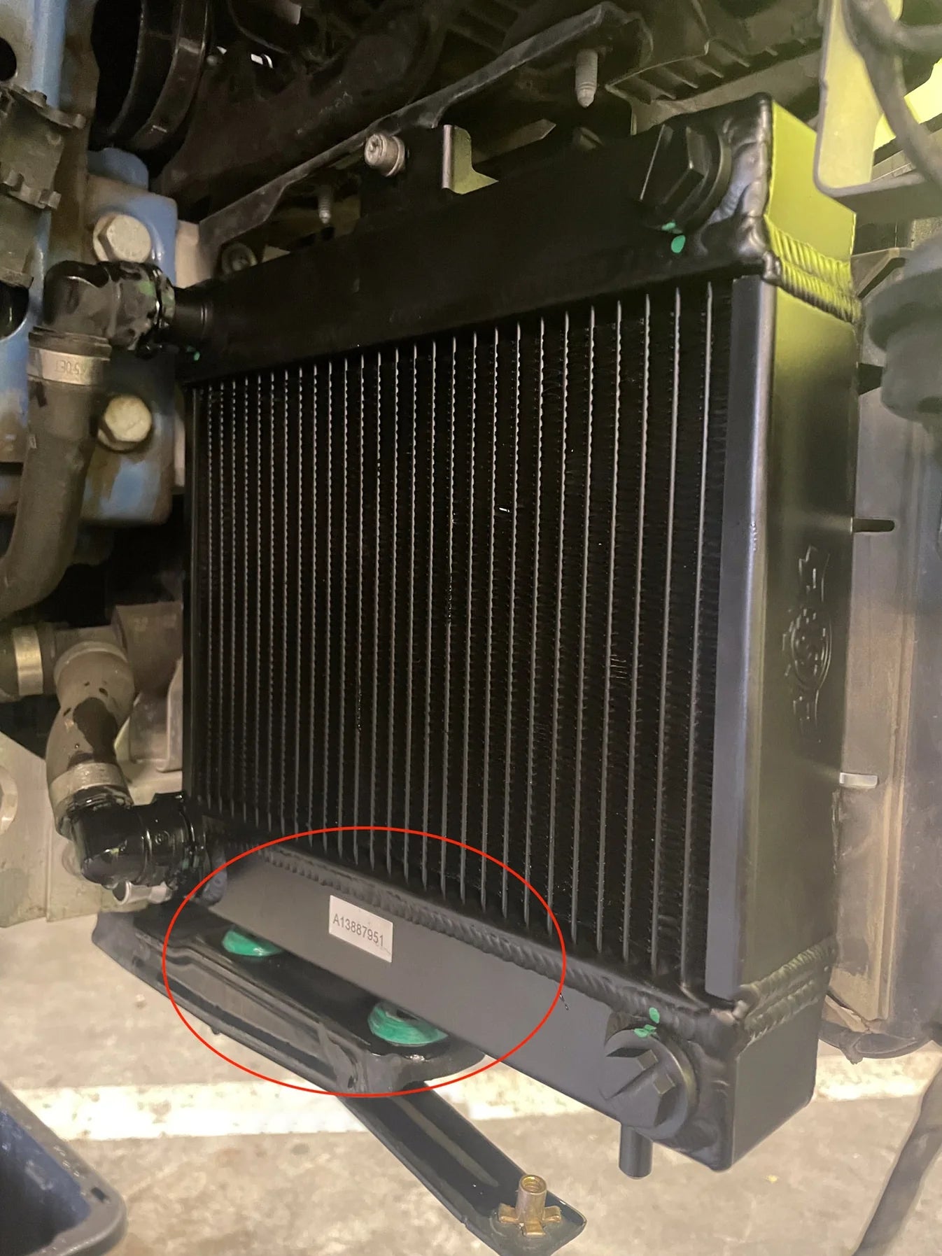 Auxiliary radiator installed, black fin core with lower mounting guards