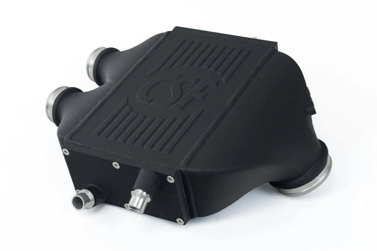 Black charge-air cooler box with silicone hoses and silver metal fittings