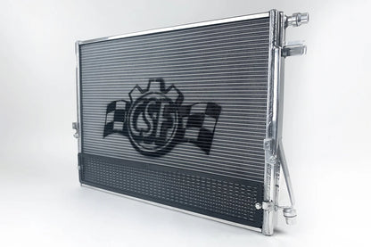 Performance heat exchanger radiator with protective rock guard and hose fittings